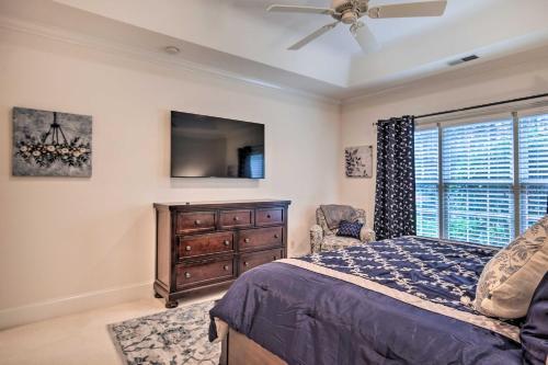 a bedroom with a bed and a dresser and a window at Upscale Home with Poker Room Less Than 1 Mi to Golf! in Aiken