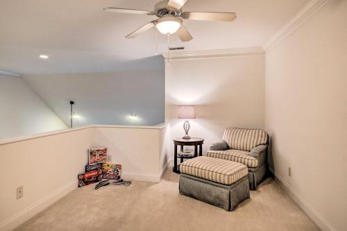 a living room with a ceiling fan and a chair at Upscale Home with Poker Room Less Than 1 Mi to Golf! in Aiken