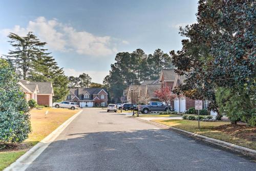 a street in a residential neighborhood with houses at Upscale Home with Poker Room Less Than 1 Mi to Golf! in Aiken