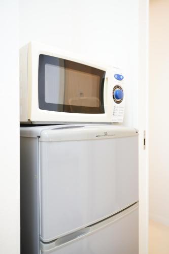 Una cocina o zona de cocina en Condominium GOLF GOLF Tsuboya