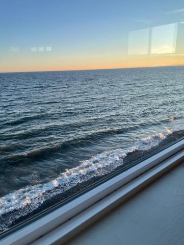 a view of the ocean from a window at The Shack Inn in Homer