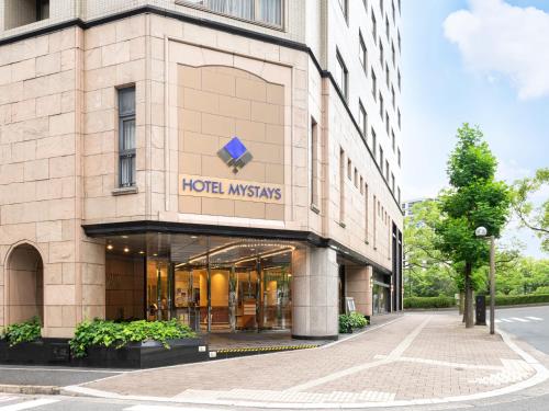 a building with a hôtel misfits sign on it at HOTEL MYSTAYS Hiroshima Peace Park in Hiroshima