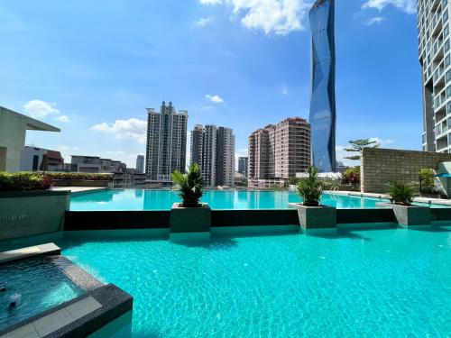 a swimming pool on the roof of a building at Deluxe Swiss Garden Residences Bukit Bintang City Center in Kuala Lumpur