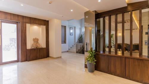 a hallway of a building with a lobby with a staircase at Aura Boutique Hotel in Udaipur