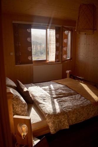 a bedroom with two beds and a window at Ferienhaus mit Charme in Attersee am Attersee
