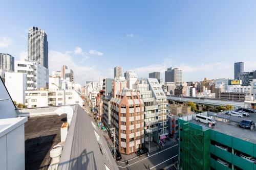 a view of a city skyline with tall buildings at TAKUTO STAY SAKAISUJI-HOMMACHI in Osaka
