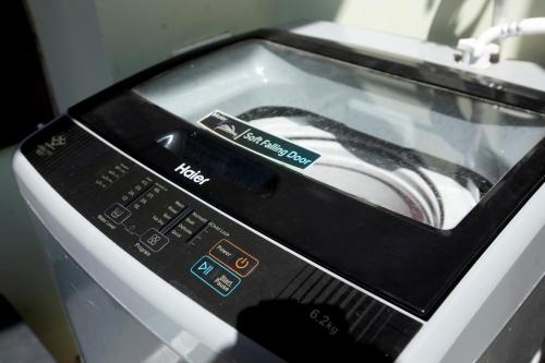 a close up of a toaster oven with its door open at Yogvan Luxury 1BHK Apartments Tapovan Rishikesh in Rishīkesh
