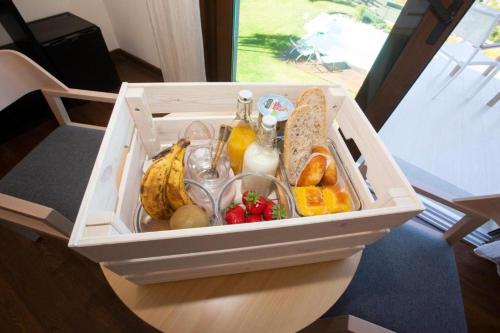 a plastic container filled with fruit and other foods at A Ballenera de Caneliñas in Cee