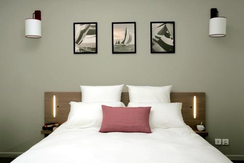 Postelja oz. postelje v sobi nastanitve Terres de France - Appart'Hotel Quimper Bretagne