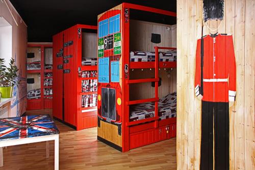 a store with red shelves and a lego refrigerator at Хостел Жить просто 2 in Pyatigorsk