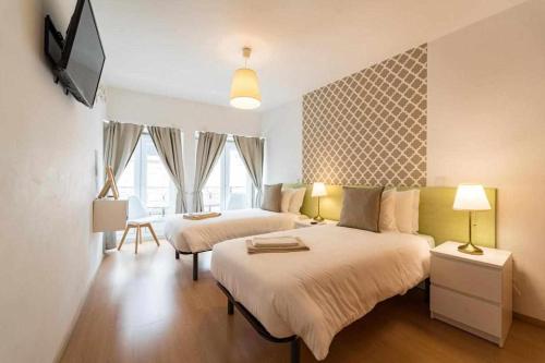 Postel nebo postele na pokoji v ubytování Sé Guesthouse