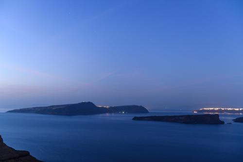 a large body of water with rocks in it at Maison Des Lys - Luxury Suites in Akrotiri