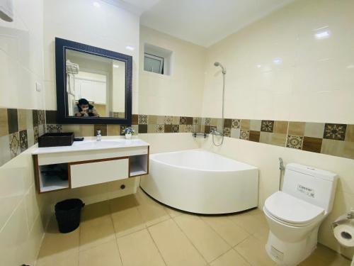 A bathroom at Libra Hotel Residence