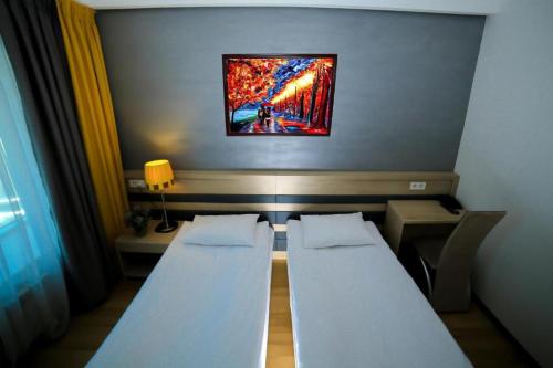 Cama o camas de una habitación en Astra Hotel
