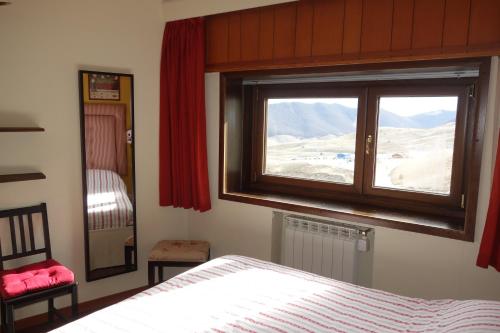 En eller flere senge i et værelse på Appartamento Roccaraso Aremogna