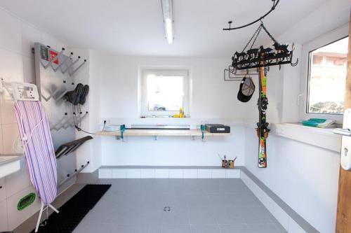 a white room with skis on the wall at Beim Schlenz in Reit im Winkl