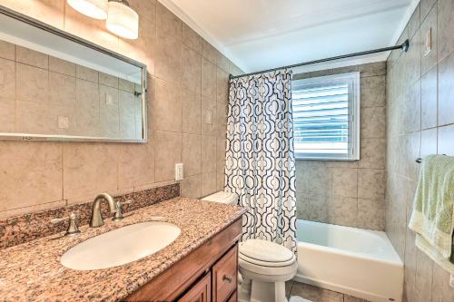 a bathroom with a sink and a toilet and a tub at 1 Mi to Beach Nokomis Home with Private Pool in Nokomis