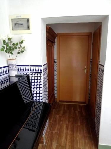a hallway with a door and a wooden floor at Rooms Izola in Izola
