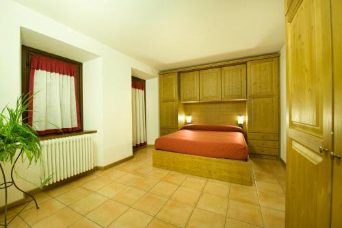 a bedroom with a bed in a room at Residence Deborah in Madesimo