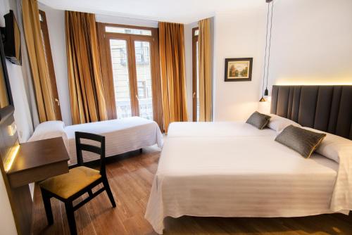 Een bed of bedden in een kamer bij Madrisol