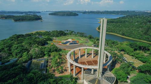 an aerial view of a building next to a body of water at Pousada Guarapiranga in Sao Paulo