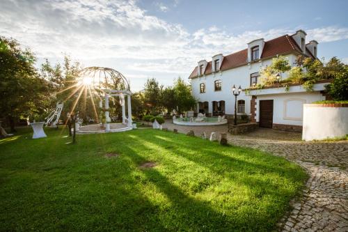 a yard with a roller coaster in front of a house at Dworek Galosa in Stronie Śląskie