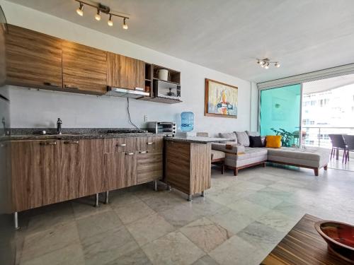 Kuchyň nebo kuchyňský kout v ubytování Aria ocean frente ala playa alberca infinita