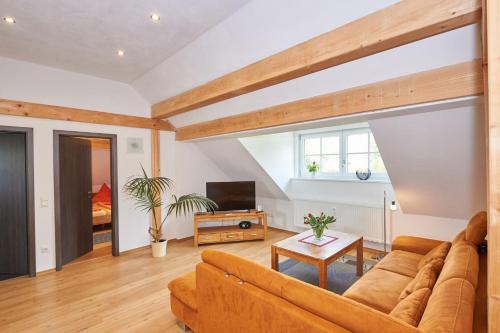 a living room with a couch and a table at Gästehaus Marzoll in Bad Reichenhall