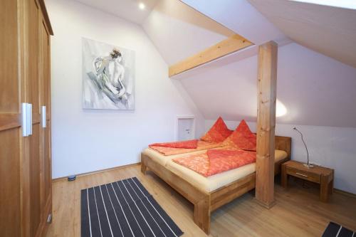 a bedroom with a bunk bed in a attic at Gästehaus Marzoll in Bad Reichenhall