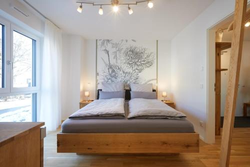 Кровать или кровати в номере Gipfelglück-Garmisch