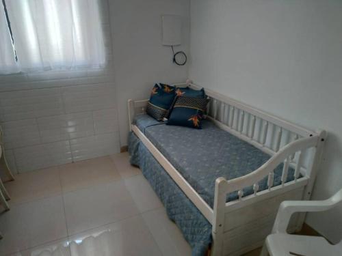 Giường trong phòng chung tại Casa agradável em Camboriú com estacionamento no pátio