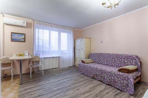 אזור ישיבה ב-Standard Brusnika Apartment na Profsoyuznoy