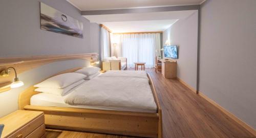 Postel nebo postele na pokoji v ubytování Hotel Hellweger