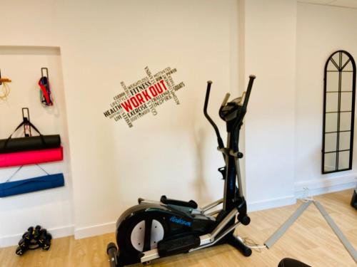 a gym with a exercise bike in a room at Best Western Plus Le Havre Centre Gare in Le Havre