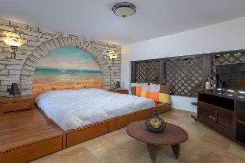 מיטה או מיטות בחדר ב-Villa Haraki Paradise