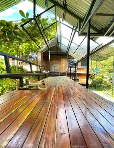 a large wooden deck with a dog laying on it at Terrazas del Golfo in La Palma