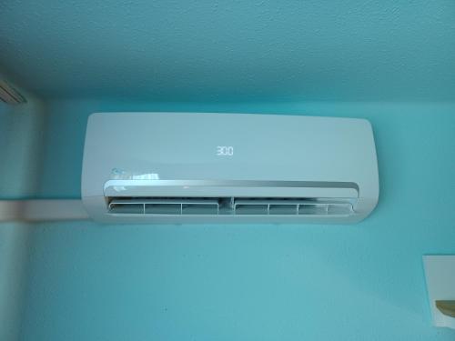 a television on the ceiling of a room at Éva Apartmanház in Eger