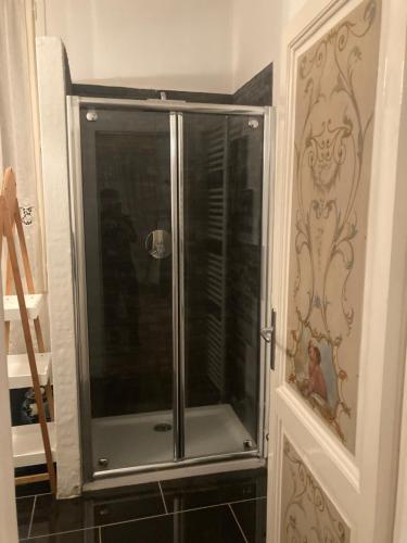 a shower in a bathroom with a glass door at Casa vacanza sole lago… in Intra