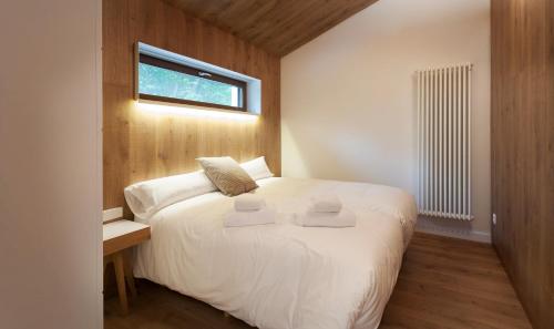 Llit o llits en una habitació de Cabañas Deluxe Basajaun Basoa by IrriSarri Land