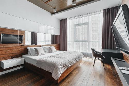 Ліжко або ліжка в номері Royal Arcadia Apartment