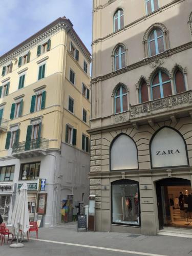 a couple of buildings on a city street at Il Balcone Sul Corso in Ancona