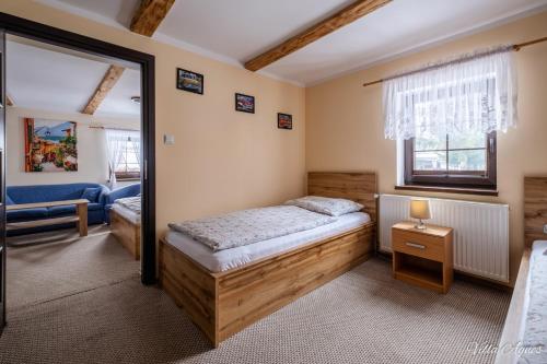 Postel nebo postele na pokoji v ubytování Villa Agnes Karpacz-Miłków