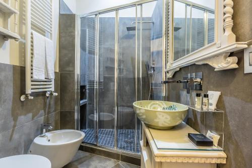 a bathroom with a sink and a shower at AB Suite Innovative Design in Bologna