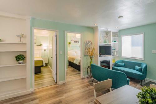 a living room with a bed and a room with a couch at Beachside Inn in Seaside