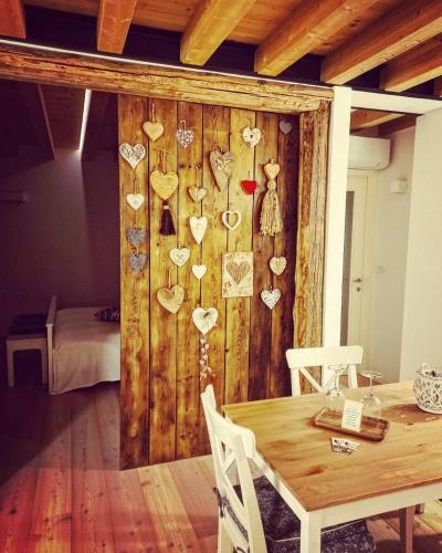 a room with a wooden wall with hearts on it at Pie Castello in Susegana