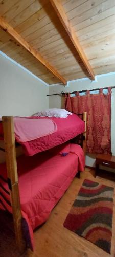 Кровать или кровати в номере Cabaña Las Orquideas 1 Laguna Verde, Valparaiso