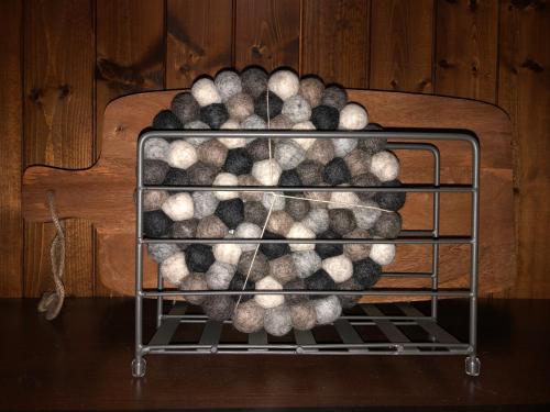 a metal rack filled with lots of balls at Blanchard Mountain BnB in Canmore