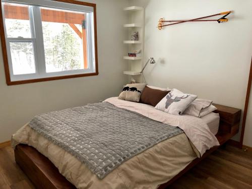 Llit o llits en una habitació de Chalet du Ruisseau