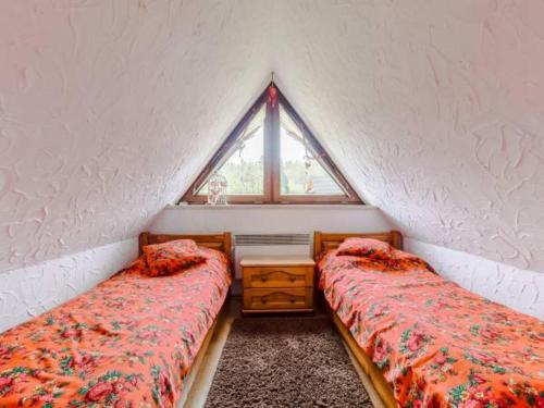 Posteľ alebo postele v izbe v ubytovaní Apartament Roza Podhala