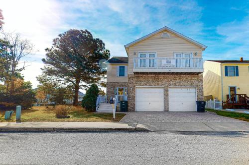 a house with two garage doors on a street at Bayside View in Ocean City